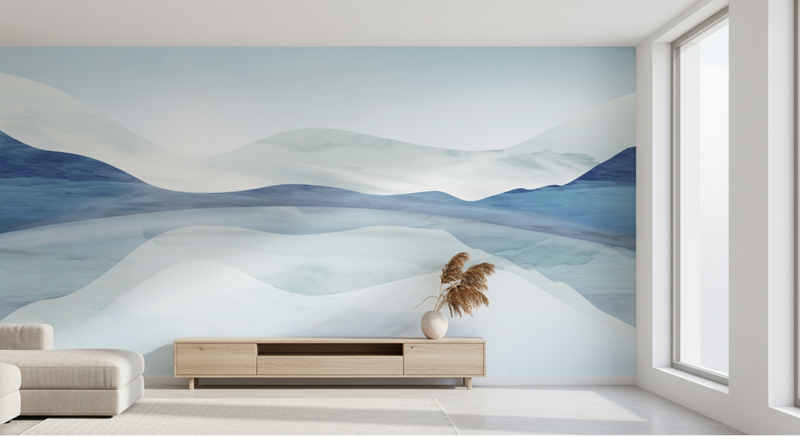 Modern living room with a large abstract wall mural of mountains.