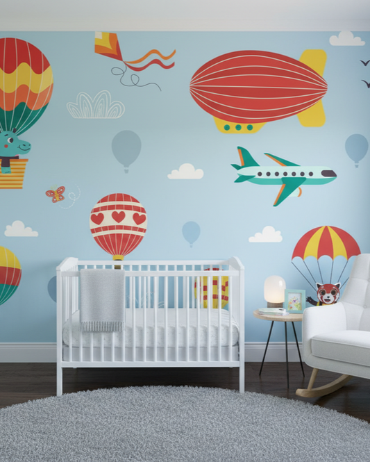Nursery room with colorful wall decals of hot air balloons, planes, and birds on a light blue wall.