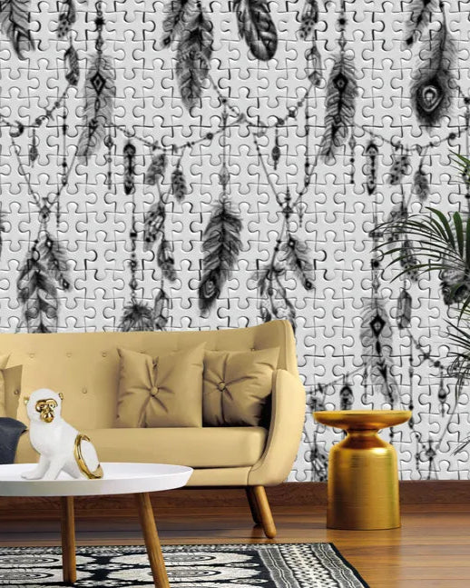 Living room with a beige sofa, coffee table, and decorative plant against a wall with feather pattern.