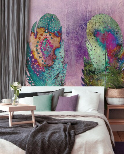 Colorful feather mural on a wall in a bedroom setting.