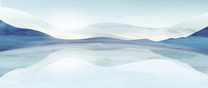 Waves of snow and ice on a mountain landscape with a clear blue sky.