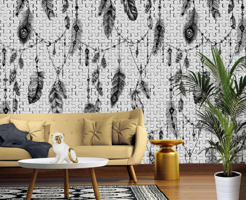 Living room with a beige sofa, coffee table, and decorative plant against a wall with feather pattern.
