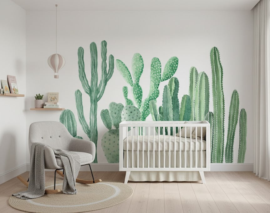 Nursery room with a crib and cactus wall mural.