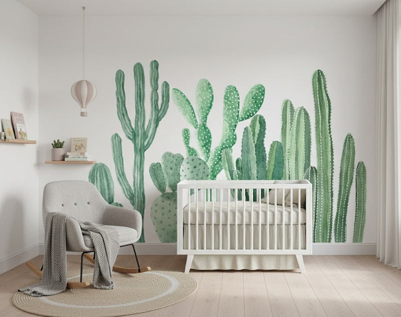 Nursery room with a crib and cactus wall mural.