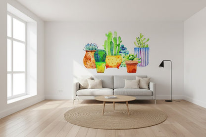 Living room with a wall featuring colorful cactus illustrations.